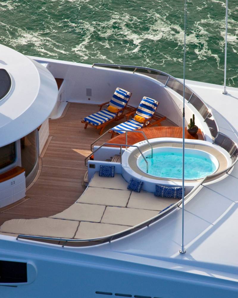 Relax in the onboard jacuzzi and soak up the sun on the spacious deck of this luxurious yacht.