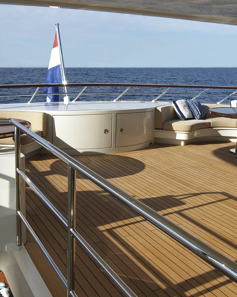Relax on the spacious deck of this luxurious yacht, enjoying the serene ocean views and gentle sea breeze.