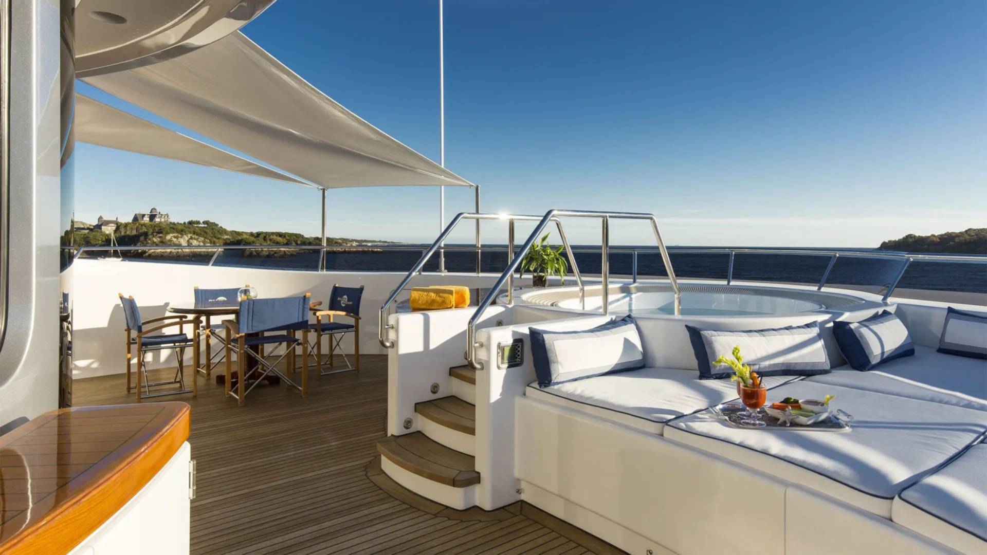 Relax on the sundeck of this luxurious yacht, complete with a hot tub and stunning ocean views.