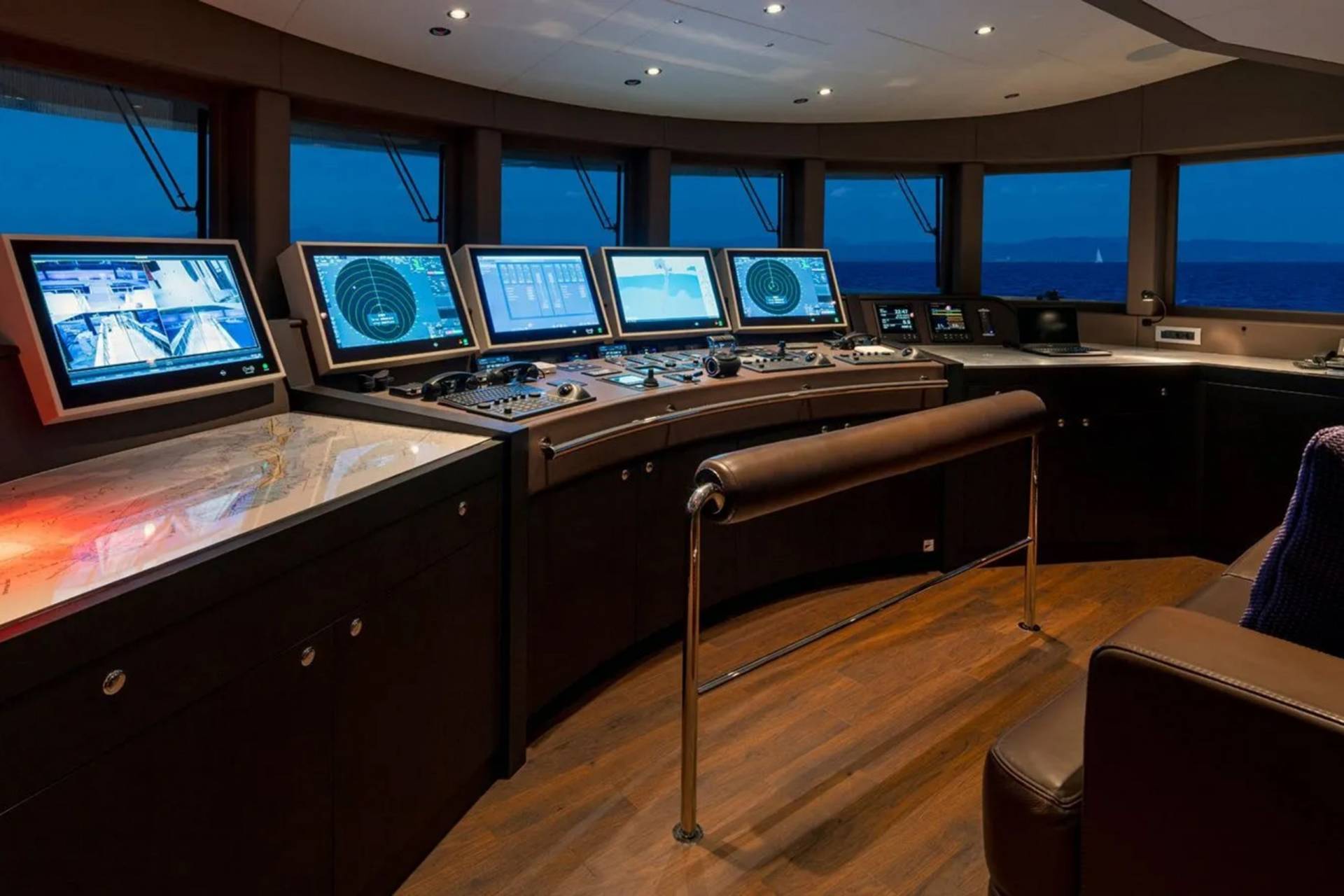 The sophisticated bridge of a luxury yacht offers panoramic ocean views and advanced navigation systems.
