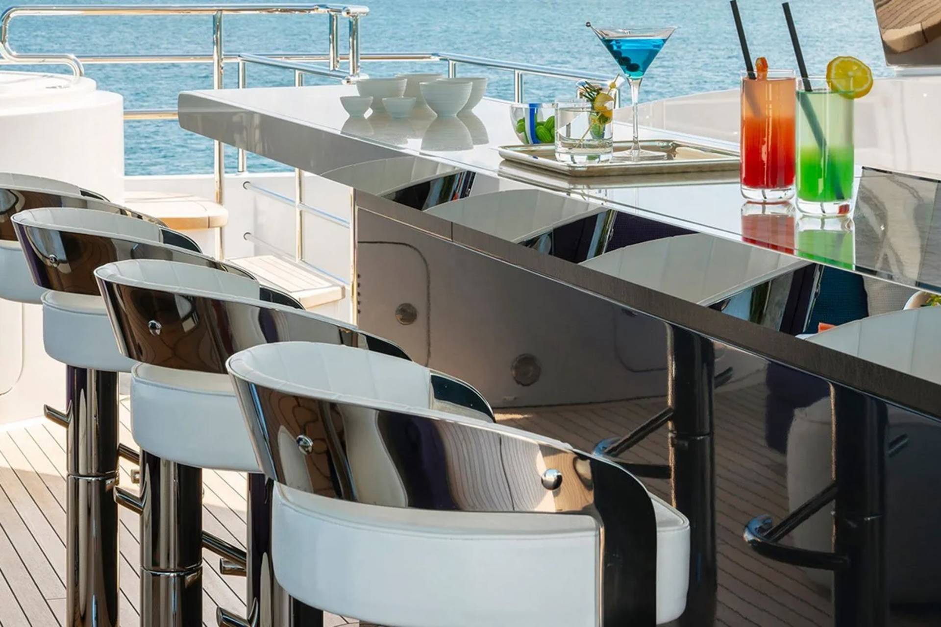 Enjoy refreshing cocktails at the sleek bar on deck, with the sparkling ocean as your backdrop.