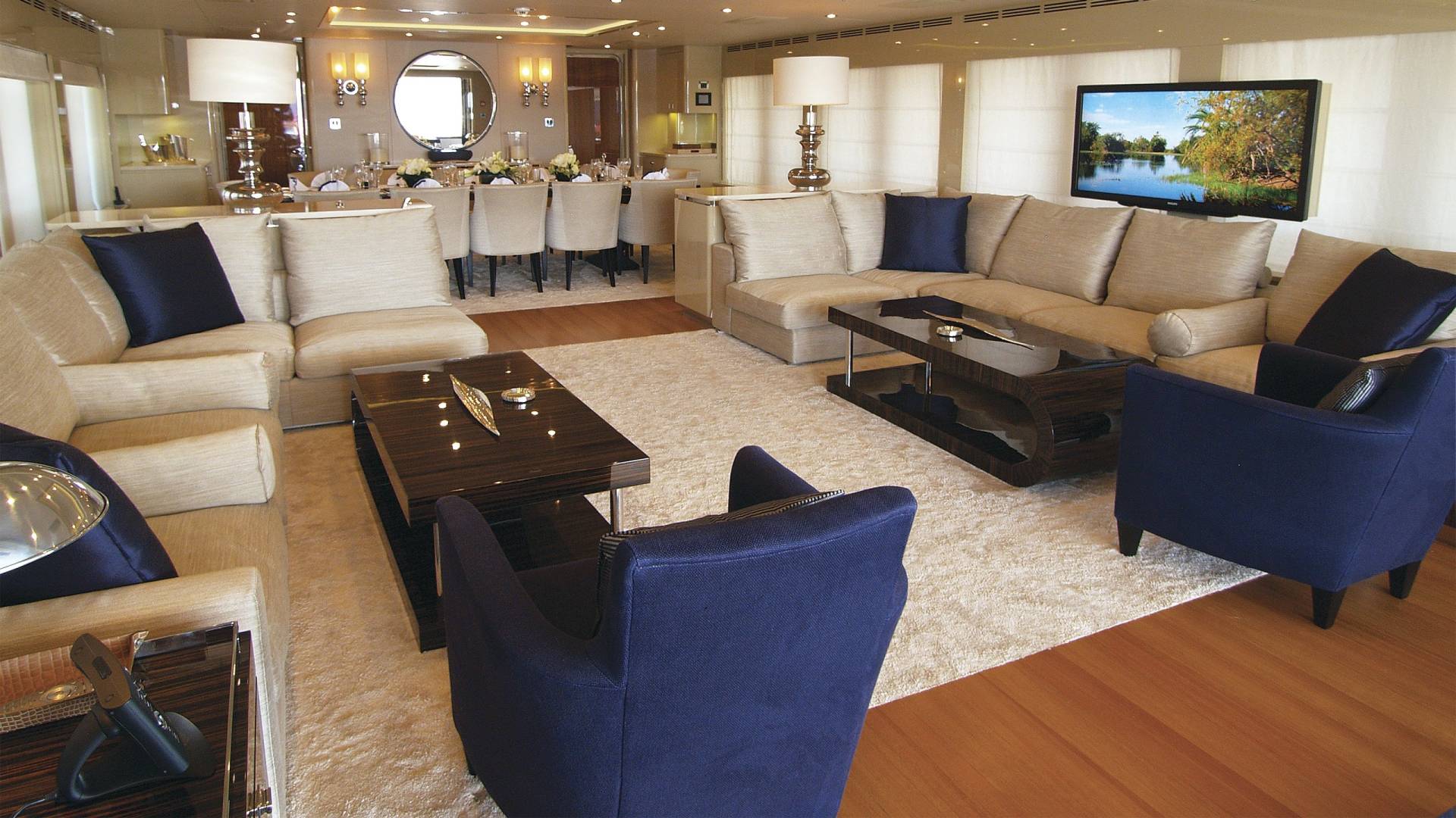 Luxurious yacht interiors offer elegant seating areas and a formal dining room for sophisticated entertaining.