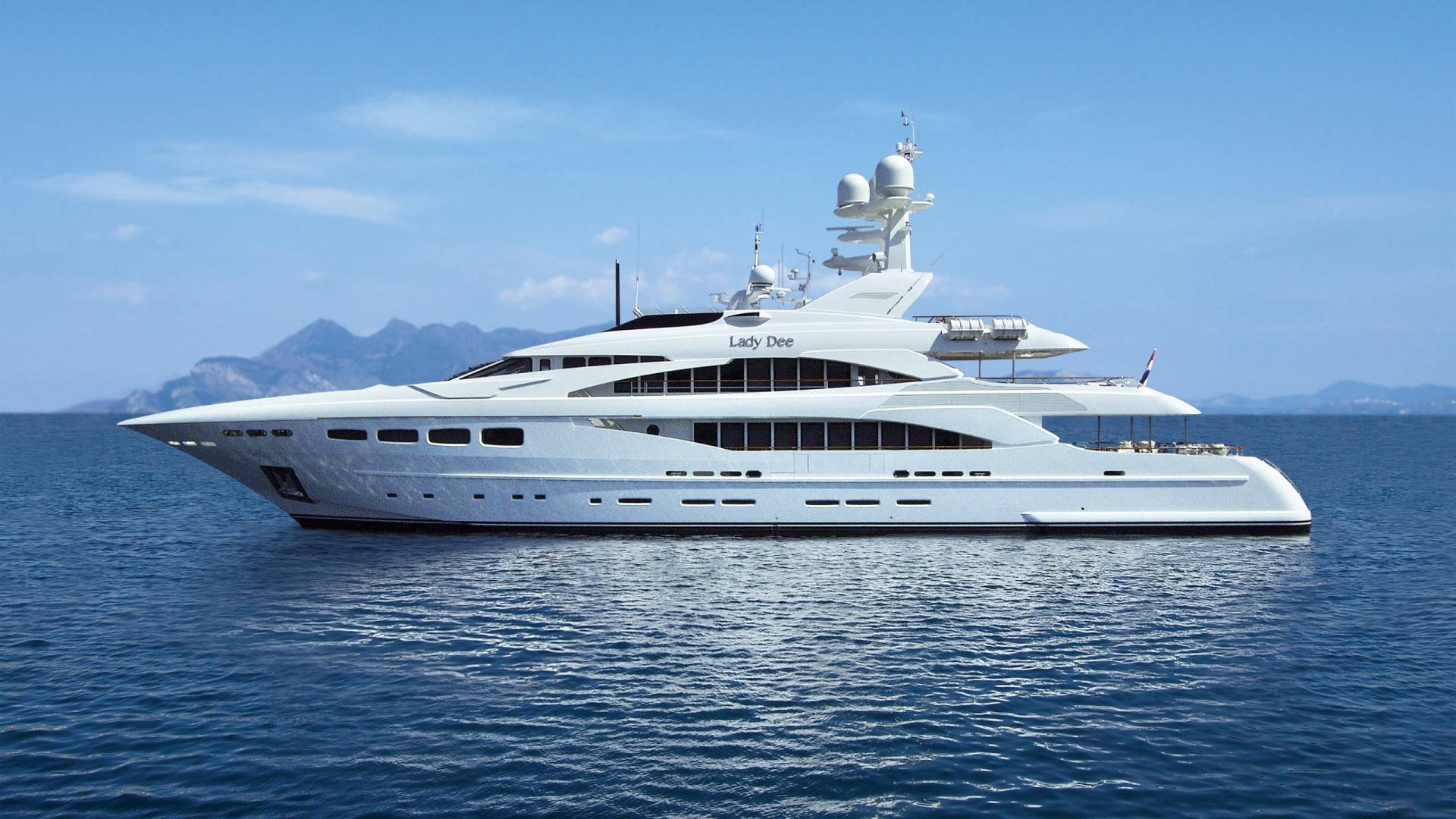 The luxurious yacht "Lady Dee" glides serenely across the calm blue waters under a clear sky.