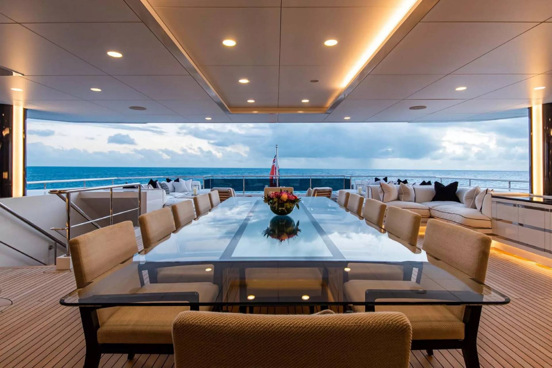 Dine al fresco on a luxury yacht's deck, surrounded by the serene ocean and stylish furnishings.