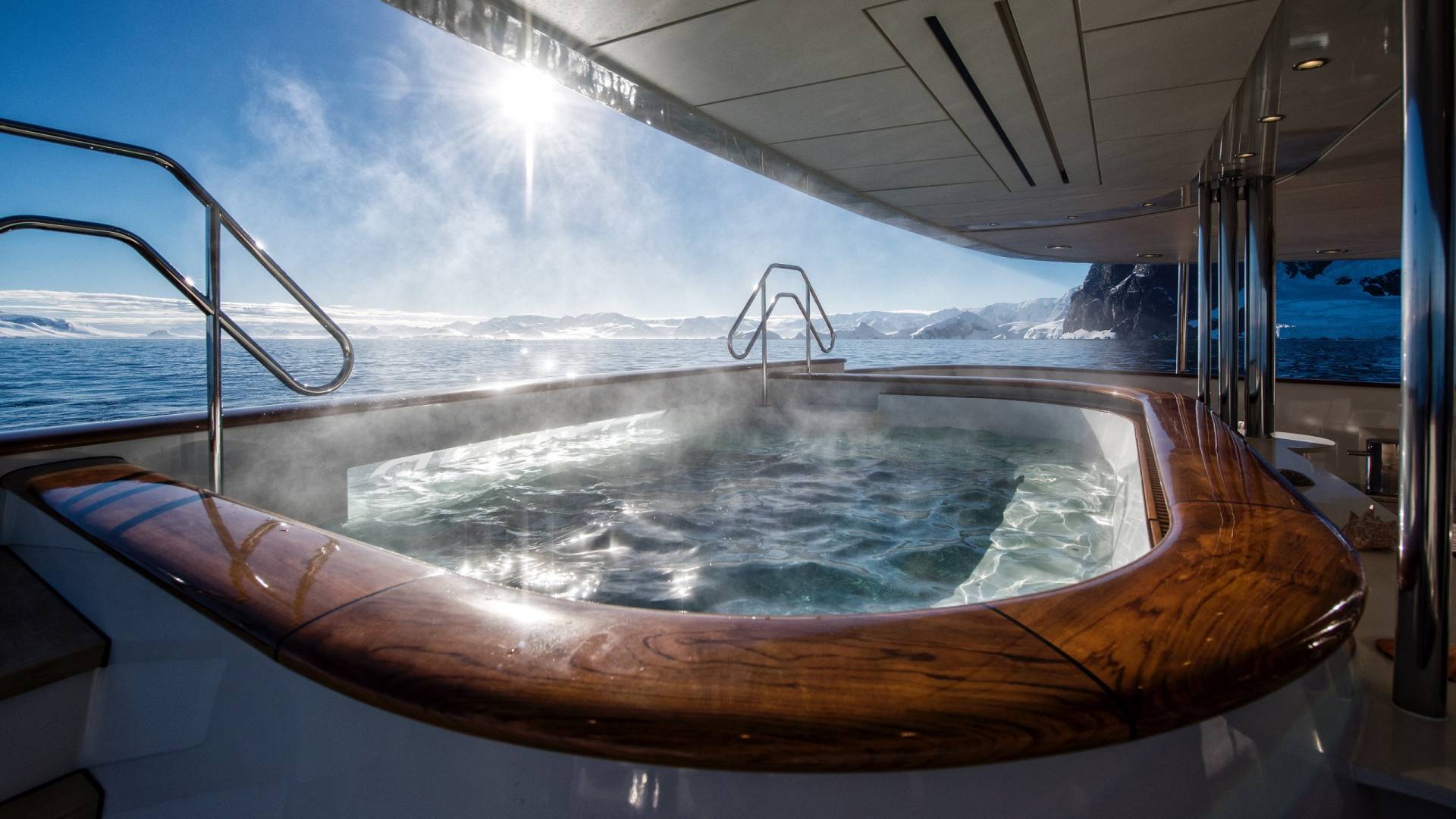 Soak in a steaming hot tub surrounded by the breathtaking icy landscapes of Antarctica.