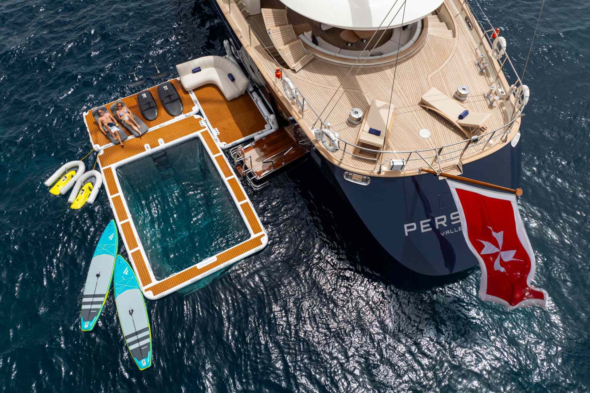 A luxurious yacht offers a floating pool and water toys for ultimate relaxation and aquatic adventures.