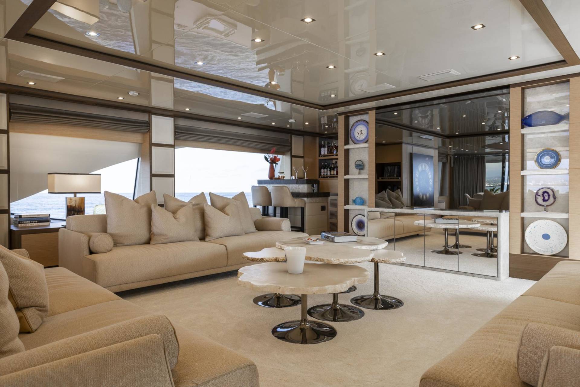 Luxurious yacht interiors feature plush seating and elegant decor, creating a serene oasis at sea.