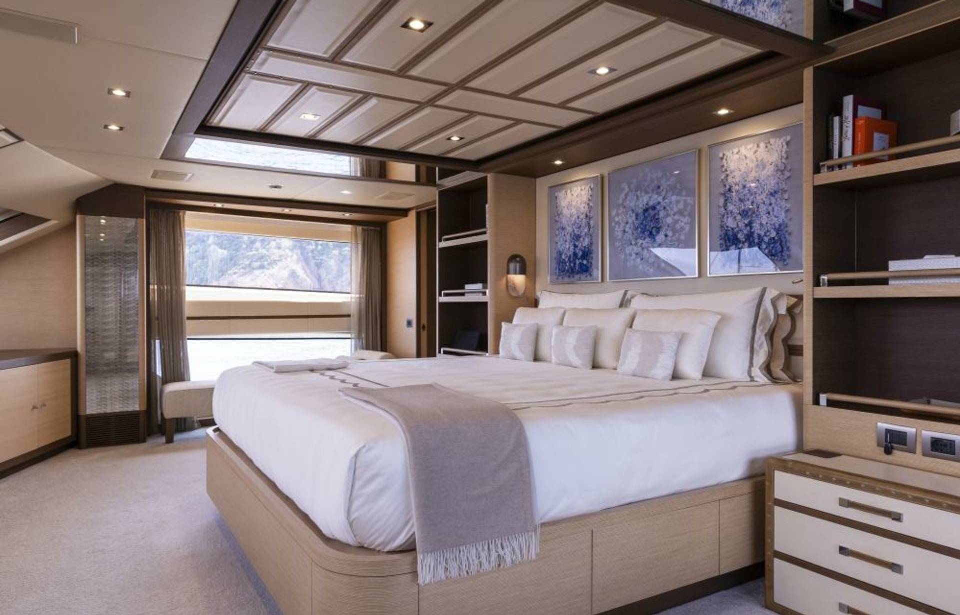 Luxurious yacht master suite offers a serene retreat with stunning ocean views and elegant decor.