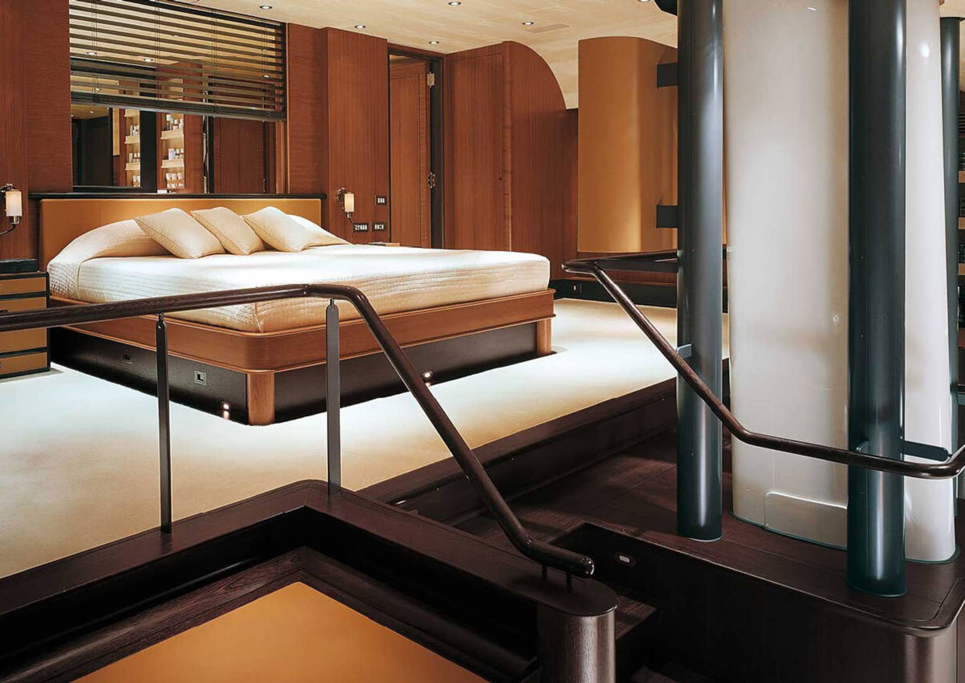 Luxurious wooden interiors and a plush king-sized bed create an opulent retreat on this yacht.