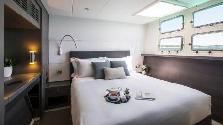 Enjoy a serene morning with tea and a book in this luxurious cabin overlooking the sparkling sea.