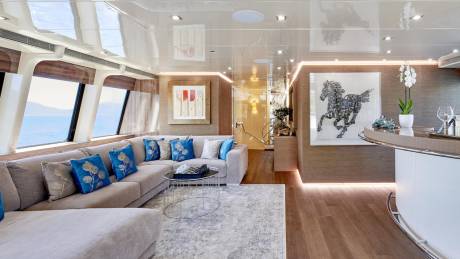 Luxurious yacht interiors blend comfort and style with stunning ocean views and artistic accents.