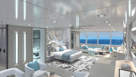 Luxurious yacht suite offers breathtaking ocean views from a king-sized bed and plush seating area.
