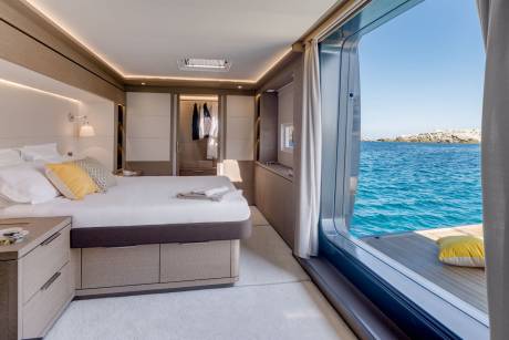 Wake up to the gentle rocking of the waves and breathtaking ocean views from this luxurious yacht cabin.