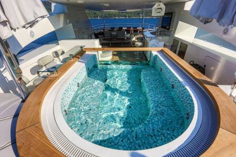 Relax in the luxurious onboard jacuzzi, surrounded by the stunning blue waters of the Mediterranean.