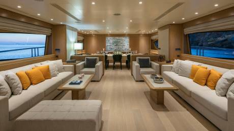 Luxurious yacht interiors offer comfortable seating and elegant dining areas with stunning ocean views.