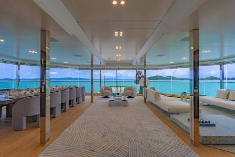 This luxurious yacht salon offers panoramic ocean views and elegant seating areas perfect for relaxation.