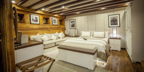 Luxurious wooden interiors and plush furnishings create a cozy retreat aboard this elegant vessel.