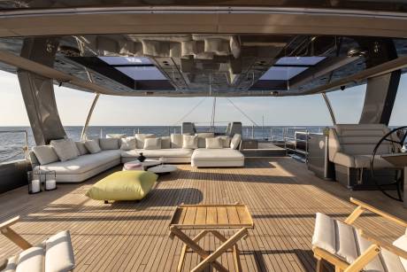 Relax on the spacious deck of this luxurious yacht, complete with plush seating and stunning ocean views.