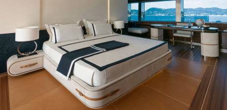 Luxurious yacht cabin offers a serene retreat with stunning ocean views and elegant furnishings.