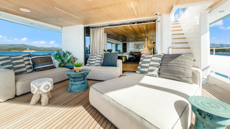 Relax on the spacious deck of this luxury yacht, enjoying breathtaking views of the azure sea and distant islands.