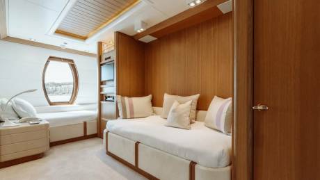 Luxurious wood paneling and plush furnishings create a serene retreat aboard this elegant yacht.