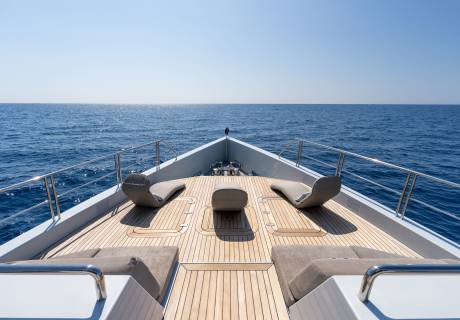 Relax on the sun-drenched deck of a luxury yacht as the azure ocean stretches to the horizon.