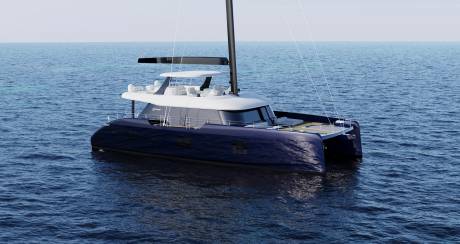 A sleek, modern catamaran yacht floating on the calm, deep blue waters of the open sea, with a clear horizon in the background.