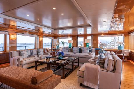 Luxurious yacht interiors offer a serene escape with plush seating and expansive ocean views.