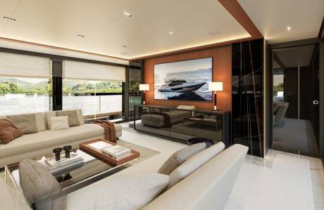 This luxurious yacht salon offers stunning ocean views and a sleek entertainment center.
