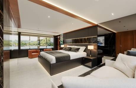 Luxurious yacht bedroom offers stunning water views and sophisticated design for ultimate relaxation.