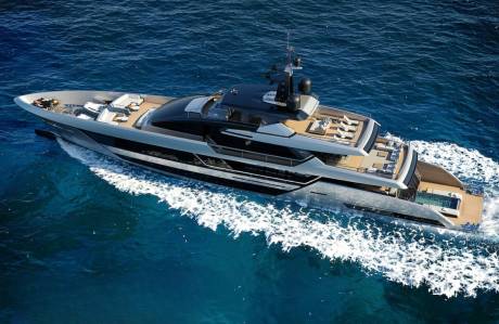 A sleek, modern yacht glides through the azure ocean, leaving a trail of white foam in its wake.