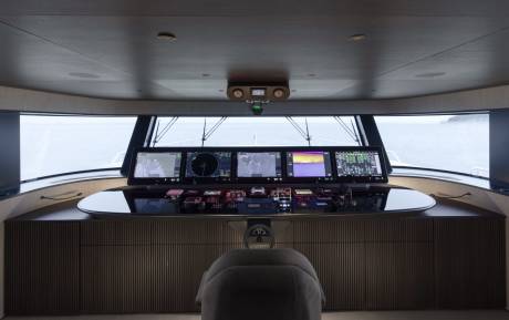 The modern yacht bridge offers panoramic views and an array of advanced navigation displays.