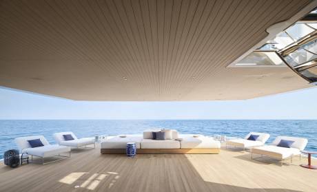 Relax on the spacious deck of a luxury yacht, surrounded by the serene blue ocean and modern comfort.