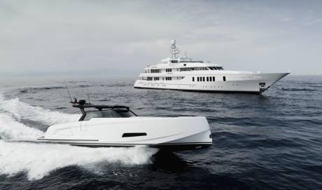 A sleek, modern white speedboat cuts through dark blue water in the foreground, with a large, luxurious white yacht sailing in the hazy background.