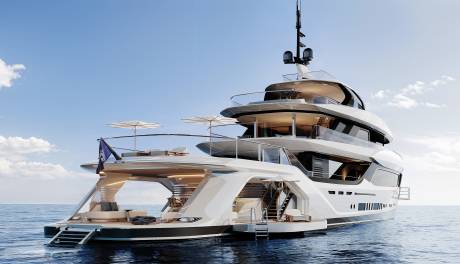 A luxurious white multi-deck yacht floats on a calm blue sea under a clear sky with scattered clouds.