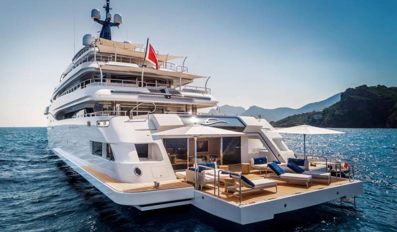 Luxurious yachting in a Mediterranean paradise with stunning coastal views and ample deck space for relaxation.