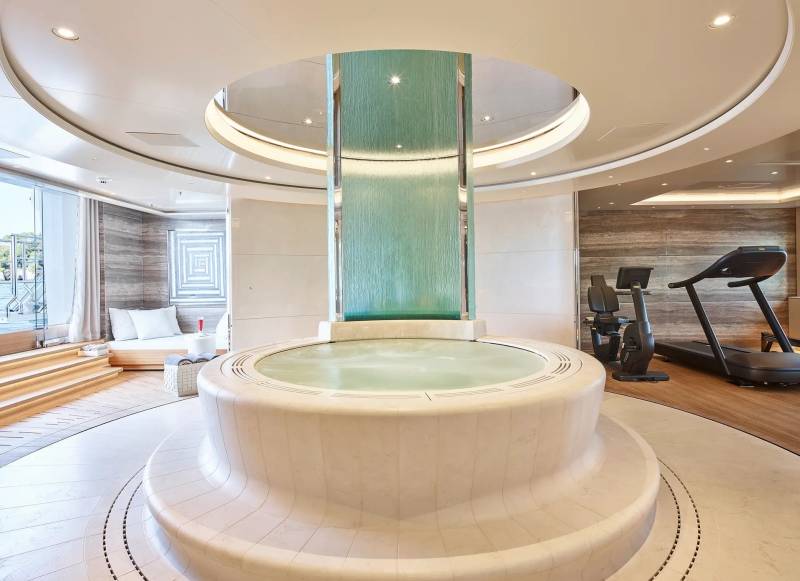 Indulge in ultimate relaxation with this luxurious spa featuring a cascading waterfall, jacuzzi, and state-of-the-art gym.